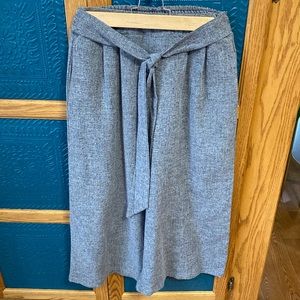 Women’s grey cropped wide leg pants.